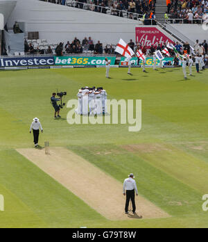 England's players form a huddle before the start of the the fourth T20