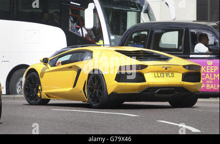 Middle Eastern cars in London. A Lamborghini drives up Park Lane in London. Stock Photo