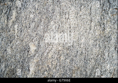 The flat surface of a gray granite stone with black dots for use as background Stock Photo