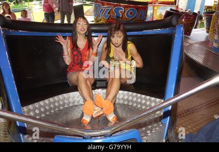 Pop stars The Cheeky Girls during the launch of National Funfair Week at Wilson's Funfair on Ealing Common in west London. National Funfair Week - in support of Great Ormond Street Hospital - has been organised by the Showmen's Guild of Great Britain as a nationwide party linking 150 events across the country. Stock Photo