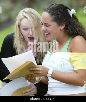 A-Level students (left to right) Georgia Ellis and Kate Antrobus who both achieved 4 A grades celebrate getting their results at Withington girls school, Manchester. Numbing fear turned to joy today for students celebrating a bumper crop of A grades at A-Level. Tales of outstanding achievement poured in from all over England, Wales and Northern Ireland as school leavers looked forward to life after getting their results. Stock Photo