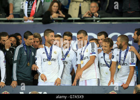 Real Madrid's Angel di Maria (left), Sergio Ramos (second left), Cristiano Ronaldo (centre), Pepe (third right), Luka Modric (second right) and Karim Benzema (right) celebrate after winning the UEFA Super Cup Stock Photo