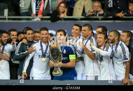 Real Madrid's Angel di Maria (second left), Sergio Ramos (second left), Iker Casillas (centre), Cristiano Ronaldo (fourth right), Pepe (third right), Luka Modric (second right) and Karim Benzema (right) celebrate after winning the UEFA Super Cup Stock Photo