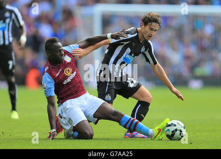 Aston Villa's Aly Cissokho (left) and Newcastle United's Daryl Janmaat battle for the ball during the Barclays Premier League match at Villa Park, Birmingham. Stock Photo