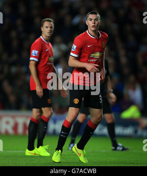 Soccer - Capital One Cup - Second Round - Milton Keynes Dons v Manchester United - Stadium:mk. Manchester United's Michael Keane with Jonny Evans (left) Stock Photo