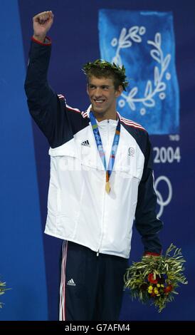 American swimmer Michael Phelps celebrates after winning a Gold medal in the Men's 400m Individual Medley final at the Olympic Games in Athens, Greece, Saturday 14th August, 2004. Stock Photo