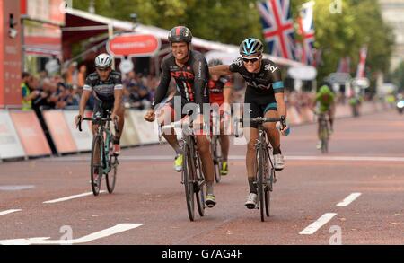 NFTO's Adam Blythe (left) is congratulated by second placed Sky Cycling's Ben Swift after winning the Prudential RideLondon Classic during the Prudential RideLondon in London. Stock Photo