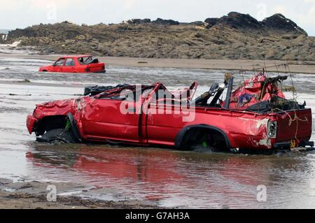 Cars washed up on Crackington Haven Beach. Scores of villagers were airlifted to safety after a wall of water tore through the once picturesque north Cornwall town of Boscastle yesterday. Around five inches of rain fell in seven hours in the area and an estimated 3ft of water tore through the streets of the village, which lies in a deep valley leading to the sea. Stock Photo