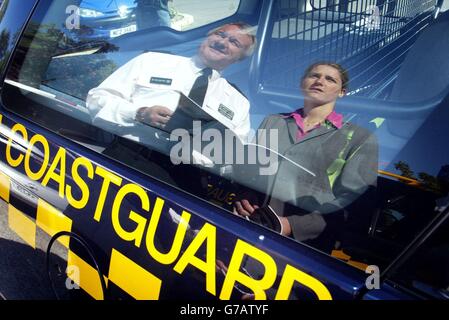 Chief Superintendent of the Police Service in Northern Ireland, Wesley Wilson and Gillian Underwood, the Deputy Director of London Resilience, are reflected in a Coastguard emergency vehicle, at the La Mon House hotel, Belfast. Airport chiefs, transport operators, government departments, utilities and fire and ambulance officials were attending a conference in an attempt to examine preparations for a catastrophic incident. Stock Photo