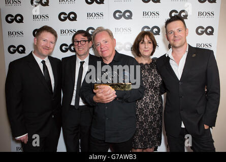 New Order band after winning the Inspiration award at the GQ Men of the Year Awards at the Royal Opera House, London. Stock Photo