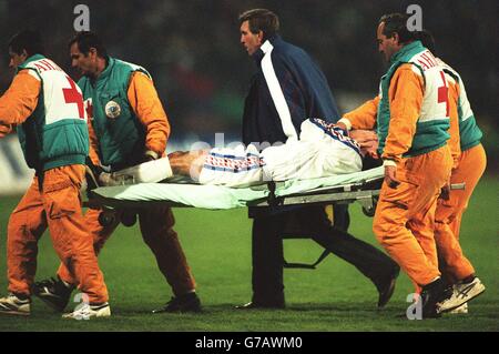 World Cup Qualifier. Yugoslavia v Czechoslovakia. Medics carry player off Stock Photo