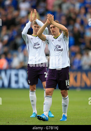 Everton's Gareth Barry (right) and John Stones applaud the fans after the Barclays Premier League match at the King Power Stadium, Leicester. Stock Photo