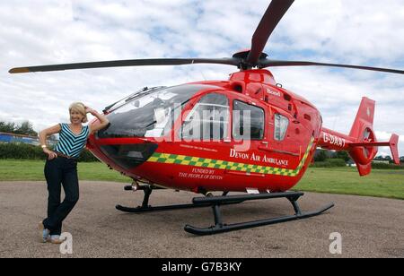 Jennie Bond with the new Devon Air Ambulance EC135 helicopter. Jennie helped sponsor the new helicopter which went into service on the 5th August 2004 with a donation of over 261.000 by taking part in the 'Im a Celebrity Get me Out of Here!' television programme. Stock Photo