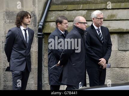 (From the left) Newcastle United captain Fabricio Coloccini, Newcastle United assistant manager John Carver, Newcastle United managing director Lee Charnley and manager Alan Pardew stand outside St Mary's Cathedral, Newcastle, where the the funeral of Flight MH17 victim Liam Sweeney took place. Stock Photo