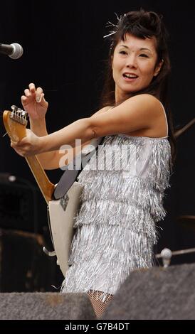 Ronnie 'Yoshiko' Fujiyama of Japanese rock band The 5.6.7.8s performing on the Main Stage, during the second day of The Carling Weekend: Reading Festival. The annual three-day festival, which takes place simultaneously in Reading and Leeds features performances from The Darkness, White Stripes, Franz Ferdinand and Green Day. Stock Photo