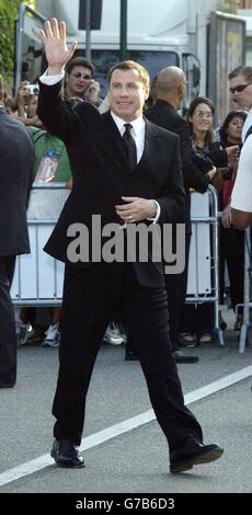 AP, AFP OUT. Star of the fim John Travolta arrives for the premiere of 'A Love Song For Bobby Long' at Mostra Internazionale d'Arte Cinematografica Lido in Venice, Italy during the 61st annual Venice Film Festival. Stock Photo