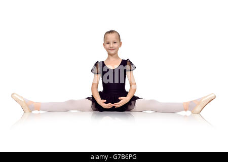 little ballerina sat on the twine on white background Stock Photo