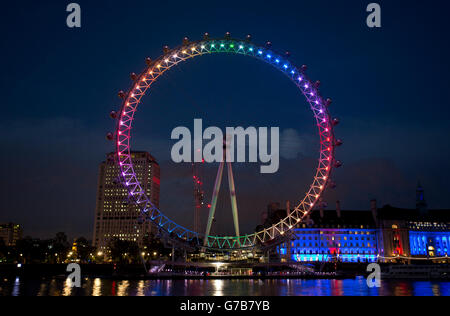 The Coca-Cola London Eye in London is lit up in the colours of the rainbow in support of Pride in London. Stock Photo
