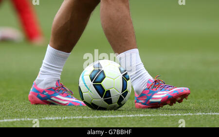 Soccer - Barclays Premier League - Arsenal v Manchester City - Emirates Stadium. Rainbow laces can be seen on the boots of Arsenal's Lukas Podolski during the warm up Stock Photo