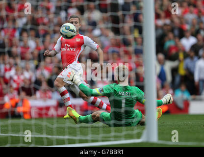 Soccer - Barclays Premier League - Arsenal v Manchester City - Emirates Stadium. Arsenal's Jack Wilshere scores his sides first goal during the Barclays Premier League match at the Emirates Stadium, London. Stock Photo