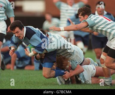 Rugby Union ... Cambridge University v French Barbarians. Alexander Bouyssie, French Barbarians (left) tries to escape a Cambridge University tackle Stock Photo