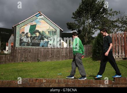 A mural painted on the side of a house in the Whiterock estate, Belfast. Stock Photo