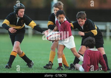 Rugby Union ... Cambridge University v French Barbarians. Youngsters get their chance to shine on the pitch in a game of mini rugby at Cambridge Stock Photo