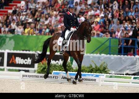 Great Britain's Carl Hester riding Nip Tuck competes in the Dressage Freestyle Grand Prix during day six of the Alltech FEI World Equestrian Games at Stade D'Ornano, Normandie, France. Stock Photo