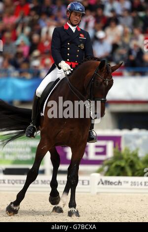 Great Britain's Carl Hester riding Nip Tuck competes in the Dressage Freestyle Grand Prix during day six of the Alltech FEI World Equestrian Games at Stade D'Ornano, Normandie, France. Stock Photo