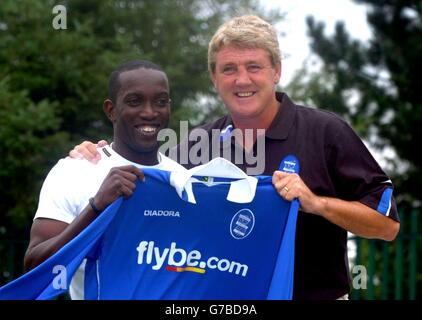 Dwight Yorke (left) is unveilled as the new Birmingham City signing at Wast Hills training ground, Birmingham with manager Steve Bruce (right). Stock Photo