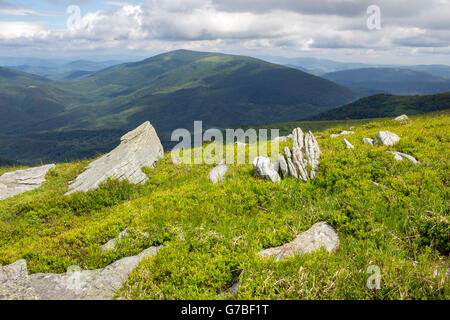 white sharp stones on the hillside on top of mountain range Stock Photo ...