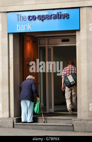 Stock photo of people entering a co-operative bank in Holborn, central London. Stock Photo
