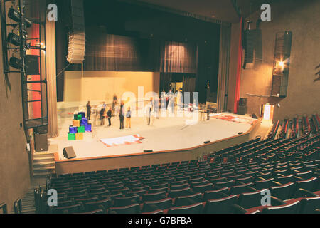 Photograph of an empty theater with red seats Stock Photo