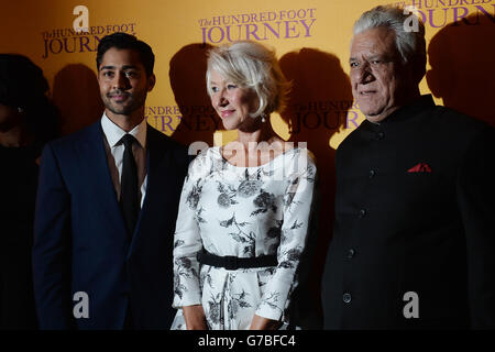 (from left) Manish Dayal, Dame Helen Mirren and Om Puri attend the gala screening of The Hundred Foot Journey at Curzon Mayfair, London. Stock Photo