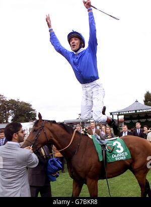 Jockey Frankie Dettori celebrates after riding Dubawi to victory in the Dunnes Stores National Stakes at the Curragh racecourse in Co. Kildare, Ireland. Stock Photo