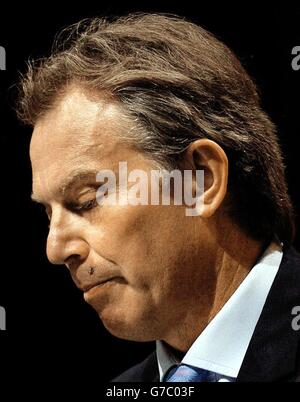 A fly lands on Britain's Prime Minister Tony Blair's lip during his speech to the TUC Conference in Brighton. The Government was today attacked for failing to repeal anti-union laws amid complaints that workers were still waiting for basic rights seven years after Labour came to power. Stock Photo