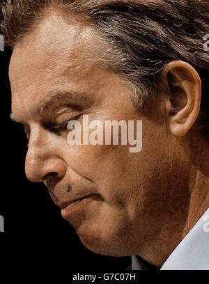 A fly lands on Britain's Prime Minister Tony Blair's lip during his speech to the TUC Conference in Brighton. The Government was today attacked for failing to repeal anti-union laws amid complaints that workers were still waiting for basic rights seven years after Labour came to power. Stock Photo