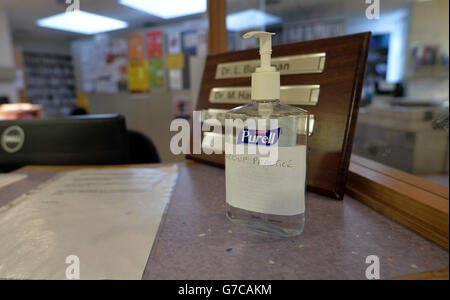 Anti-bacterial hand gel in reception at the Temple Fortune Health Centre GP Practice near Golders Green, London. Stock Photo