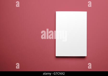 Blank magazine cover template isolated on red background with clipping path ready for your artwork Stock Photo