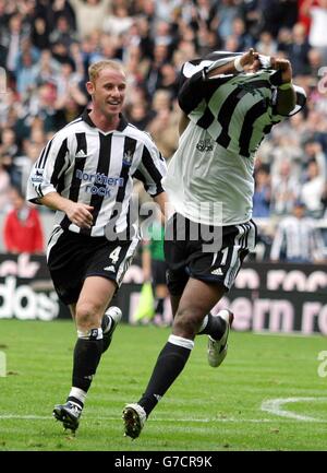 Newcastle's Patrick Kluivert celebrates scoring against West Brom by taking his shirt off during the Barclaycard Premiership match at St James' Park, Newcastle, Saturday September 25, 2004. Stock Photo