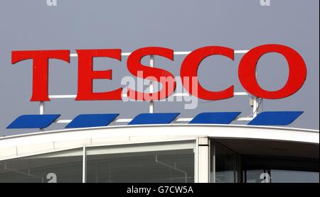 Tesco signage at their superstore in Bar Hill, Cambridgeshire, as the supermarket giant suffered fresh humiliation today after a shock admission that it overstated its profits guidance by &pound;250 million. Stock Photo