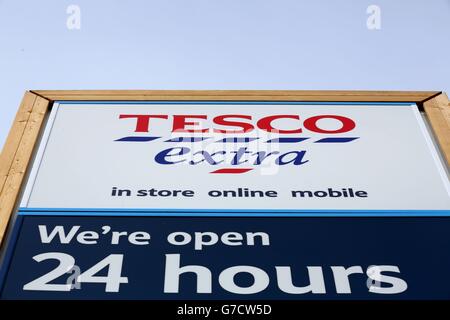 Tesco signage at their superstore in Bar Hill, Cambridgeshire, as the supermarket giant suffered fresh humiliation today after a shock admission that it overstated its profits guidance by £250 million. Stock Photo