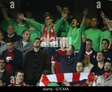 Soccer - Capital One Cup - Third Round - Tottenham Hotspur v Nottingham Forest - White Hart Lane. Nottingham Forest's fans wear green jumpers in memory of former manager Brian Clough Stock Photo