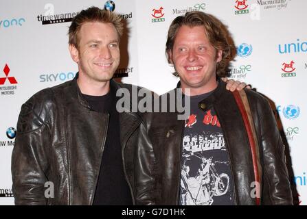 Ewan McGregor (L) and Charley Boorman arrive for the Long Way Round fundraising party in aid of UNICEF, CHAS and Macmillian Cancer Relief, to celebrate the successful completion of their transcontinental motorbike expedition held at The Bridge in Bermondsey, south east London. Stock Photo