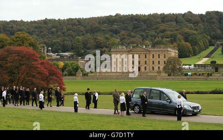 Mourners including the Prince of Wales and the Duchess of Cornwall follow the hearse for the funeral of Deborah, the Dowager Duchess of Devonshire at St Peter's Church. Stock Photo