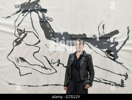 Tracey Emin poses beside her artwork at the press preview of The Last Great Adventure is You by Tracey Emin at the White Cube, London. Stock Photo