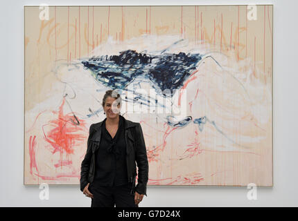 Tracey Emin poses beside her artwork at the press preview of The Last Great Adventure is You by Tracey Emin at the White Cube, London. Stock Photo