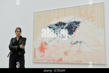 Tracey Emin poses beside her artwork at the press preview of The Last Great Adventure is You by Tracey Emin at the White Cube, London. Stock Photo