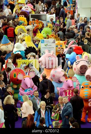 A large group of cartoon characters mingle with business visitors at the Brand Licensing Europe 2014 at Olympia, west London, Europe's biggest licencing exhibition. Stock Photo