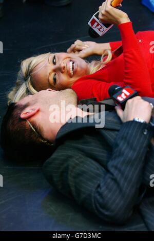 Former Baywatch babe and Playboy playmate Pamela Anderson with presenter Dave Berry during her guest appearance on MTV's TRL - Total Request Live - show at their new studios in Leicester Square, central London. Pamela is in London to promote her book 'Star: A Novel'. Stock Photo